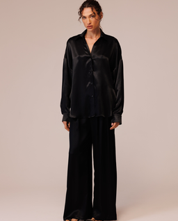 Czarne spodnie satynowe z rozcięciami - Image #1