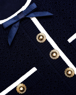 Granatowa dzianinowa sukienka mini z kokardą - Image #4