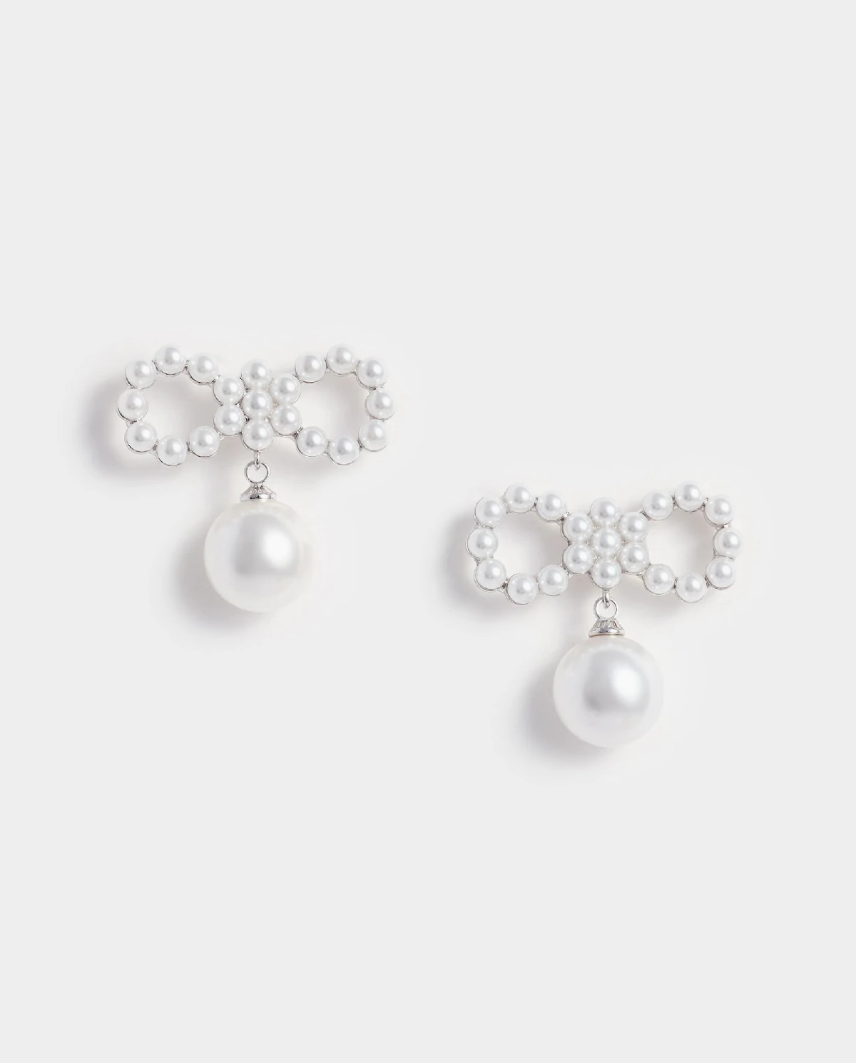 Kryształowe kolczyki kokardki - Image #0