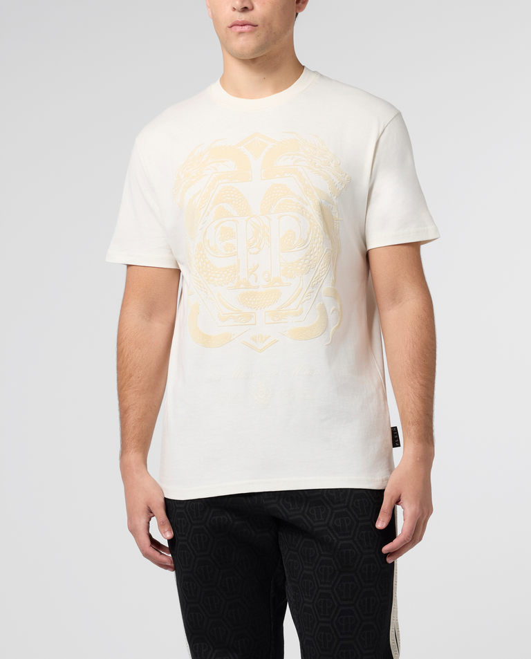 Kremowy t-shirt z motywem smoka