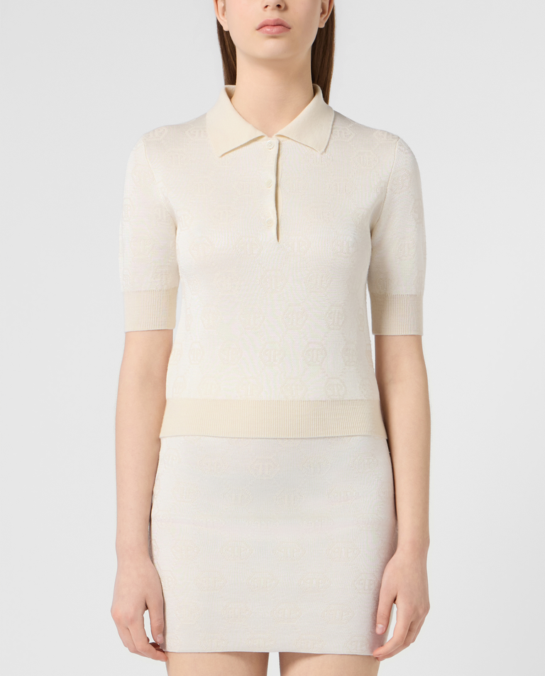 Kremowy sweter polo z monogramem