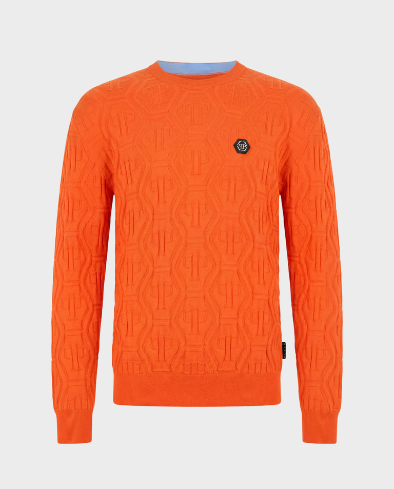 Pomarańczowy sweter z monogramem