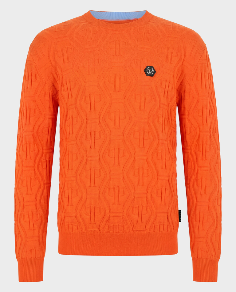 Pomarańczowy sweter z monogramem